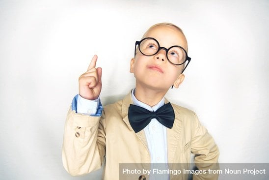 small boy thinking hard about ideas for garden landscaping