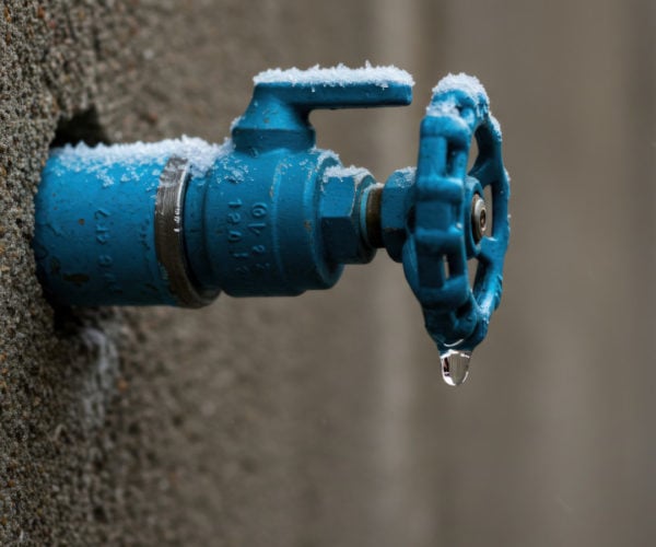 Frozen water tap with water drip