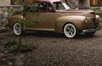 Vintage car on gravel drive