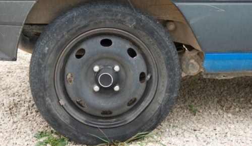Car wheel on a gravel driveway