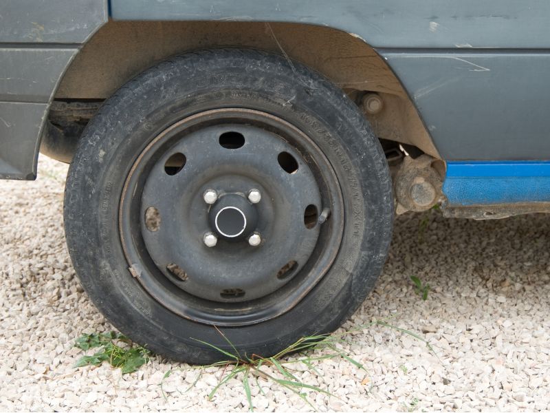 Car wheel on a gravel driveway