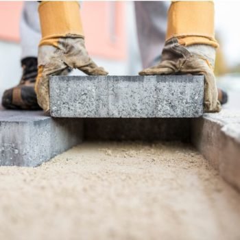 Concrete paving being laid on a sharp sand base
