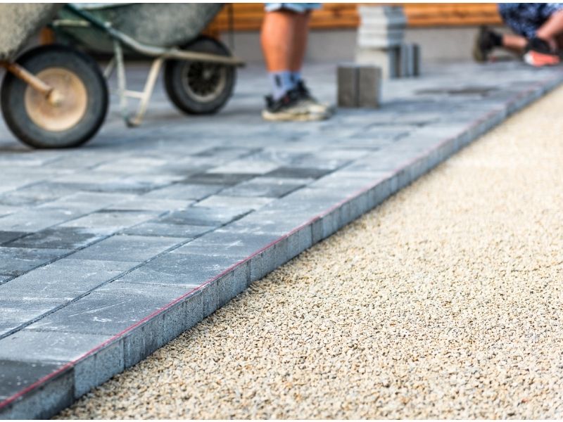 Paving blocks on sharp sand base