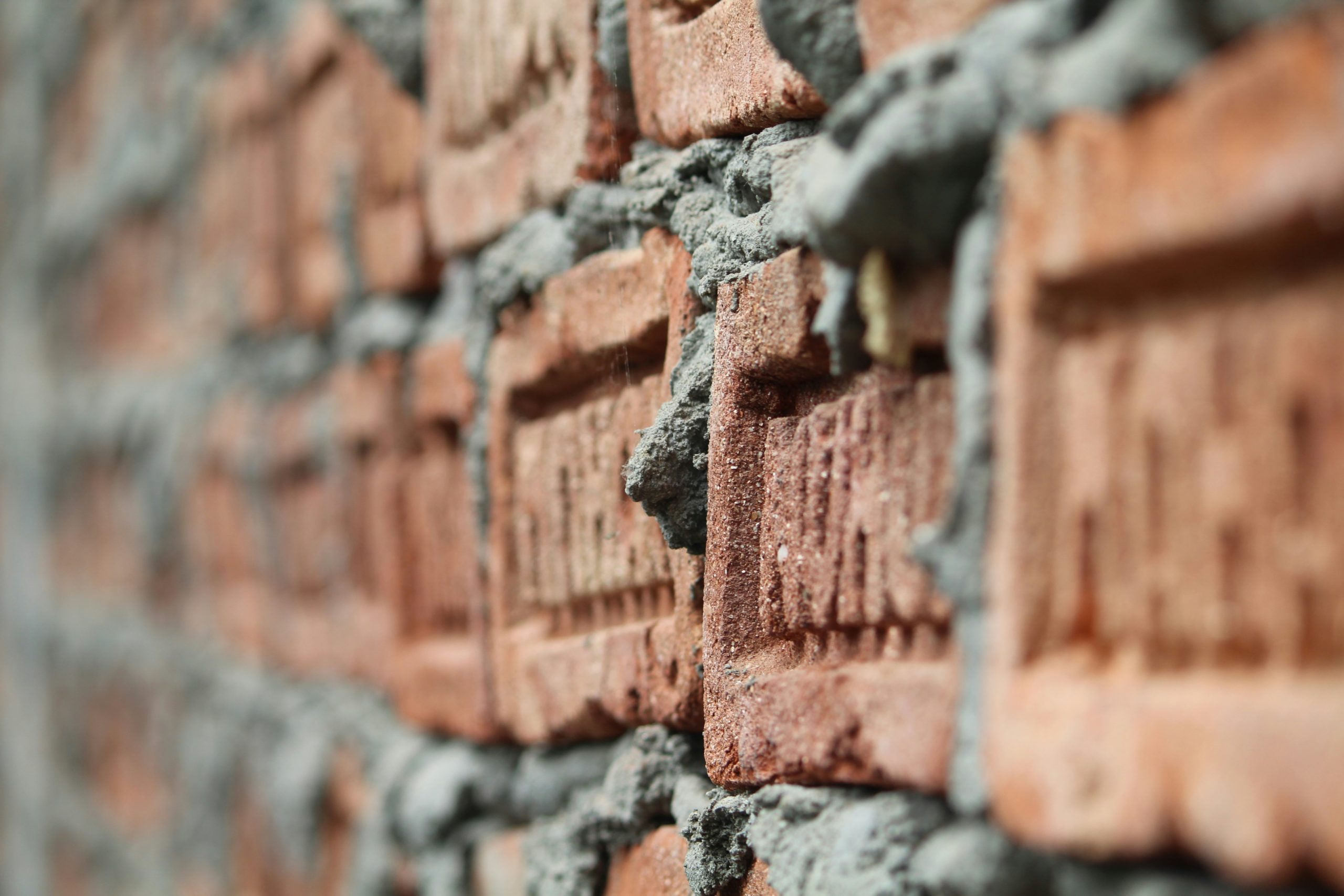 Red brick wall with mortar