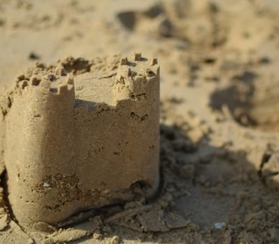 Sand castle built on a sandy beach