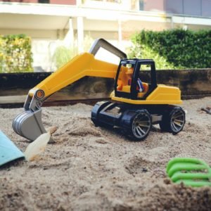 Toy digger in a kids sandpit