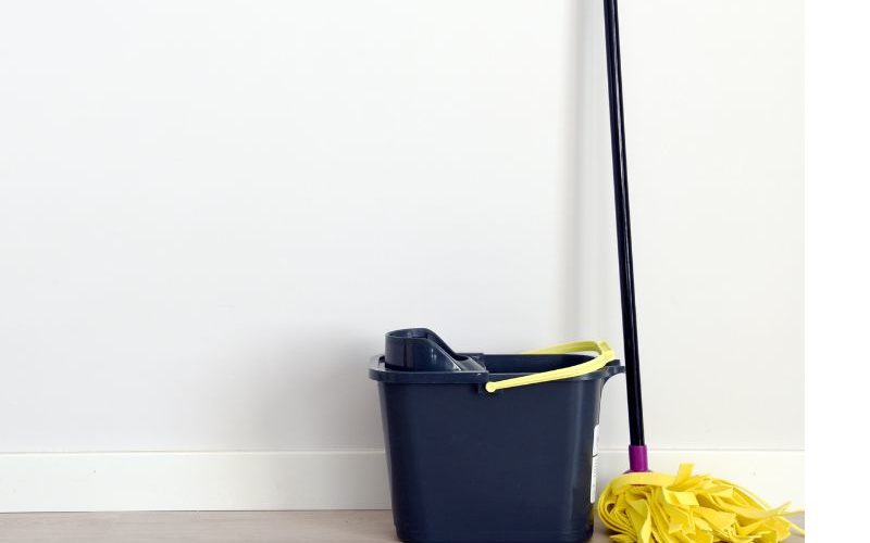 Mop and bucket against a wall