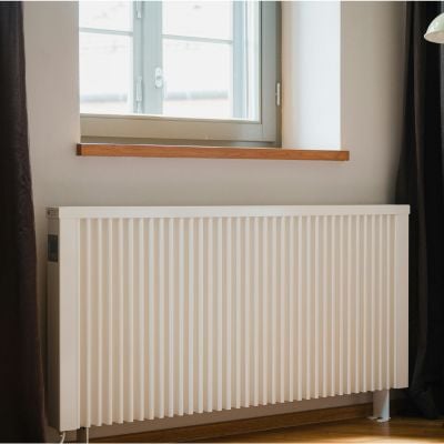 White radiator against wall with modern decor