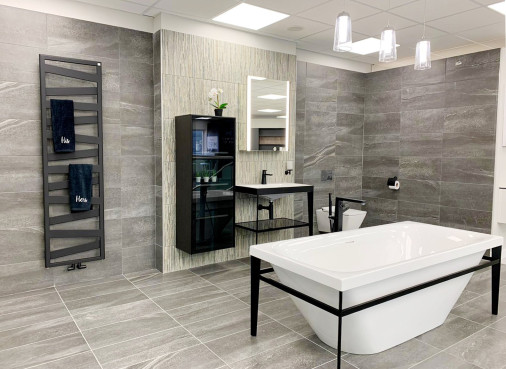 Bold black lines bathroom with statement towel radiator bathroom