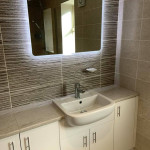 Illuminated mirrors make a small bathroom feel bigger