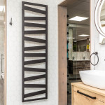Modern towel warmer uses vertical space - great small bathroom idea