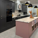 Black Shaker kitchen paired with pink and marble
