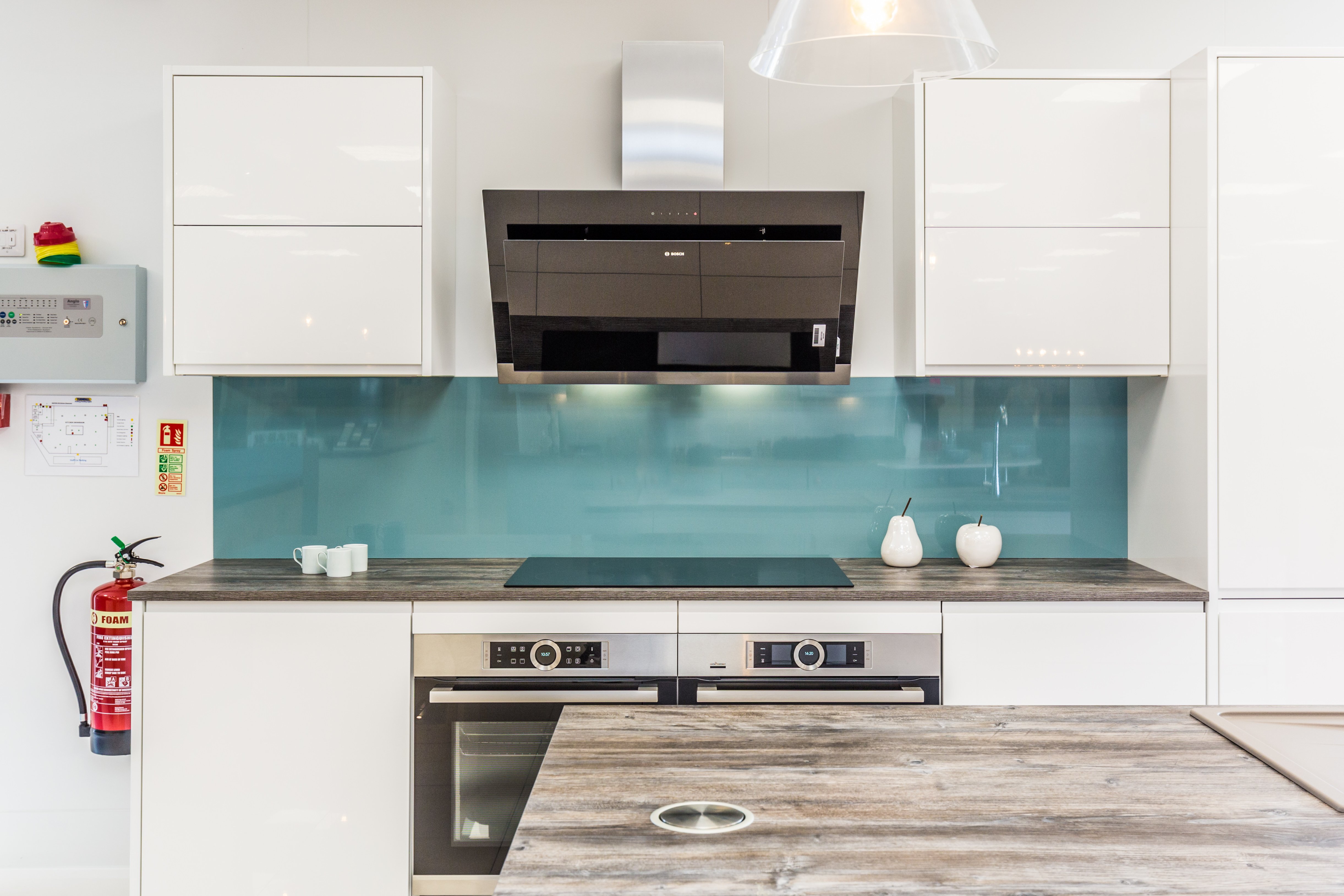 White kitchen with aqua blue backsplash - on display at Boston Kitchen showroom