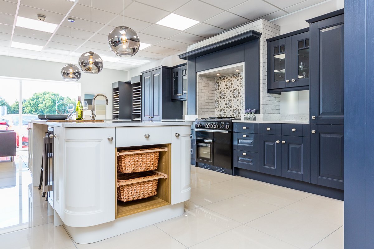 Two tone blue kitchen with white kitchen island in Boston