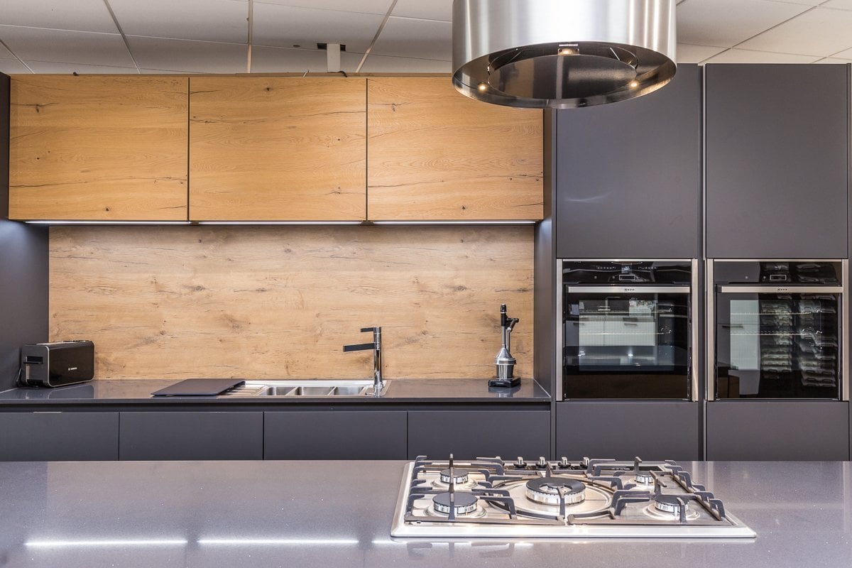 Carbon and Old Wild Oak Rotpunkt Kitchen on display at Sleaford Kitchens and Bathrooms