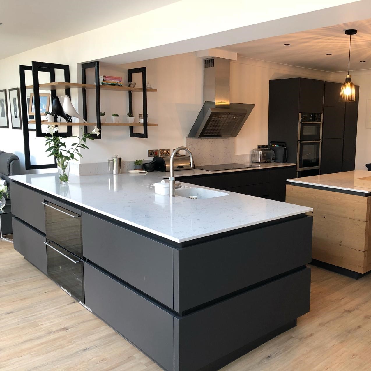 Black and wood open plan kitchen