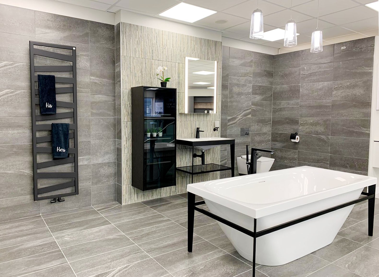 Bathroom design - modern bathroom with striking black lines and grey tiling