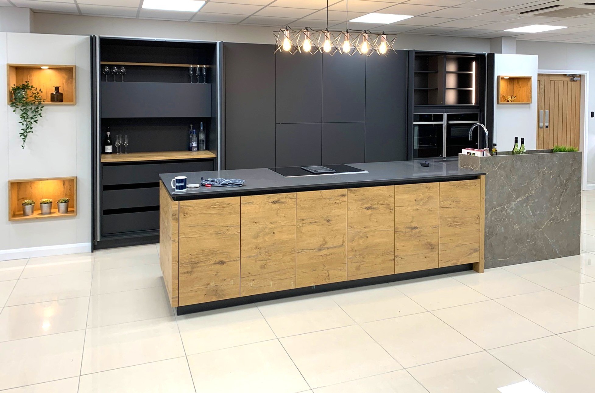 Rotpunkt Carbon and wild oak german engineered kitchen