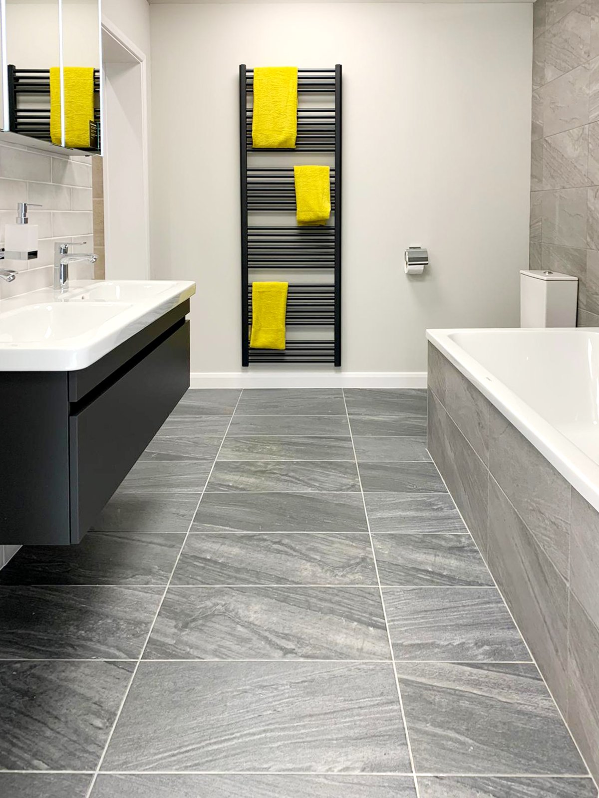 Simple contemporary bathroom with grey tiles