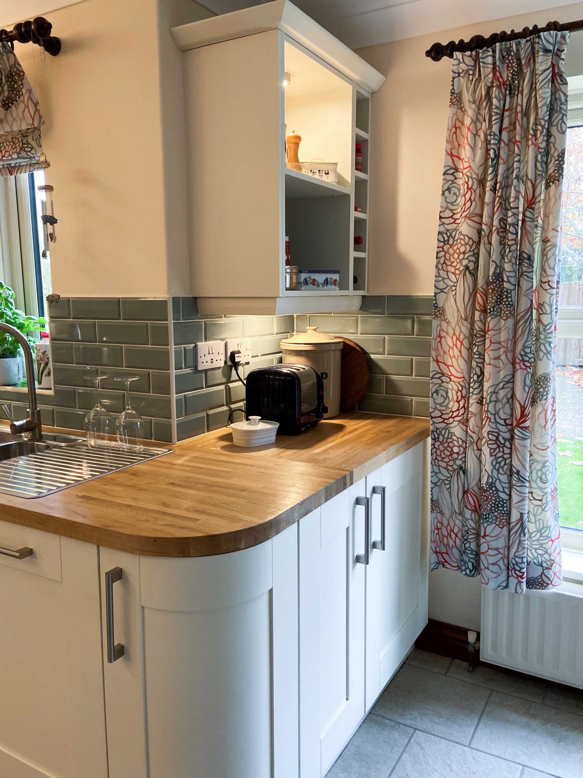 wooden-countertops-and-wine-bottle-storage-in-kitchen-cabinets