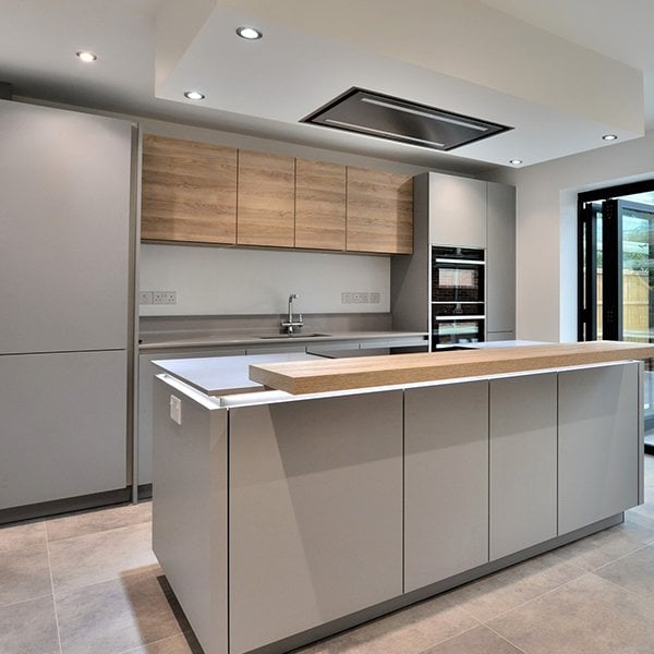 Grey kitchen with cantelevered breakfast bar on the kitchen Island - chanceoptions homes