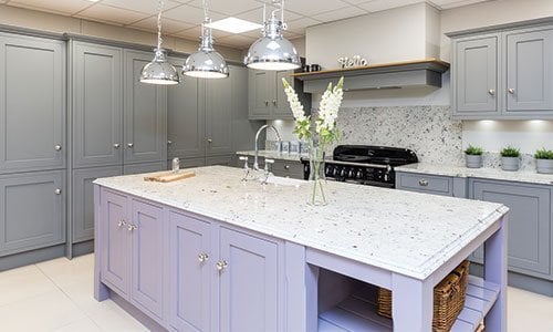 Grey kitchen with lilac kitchen island