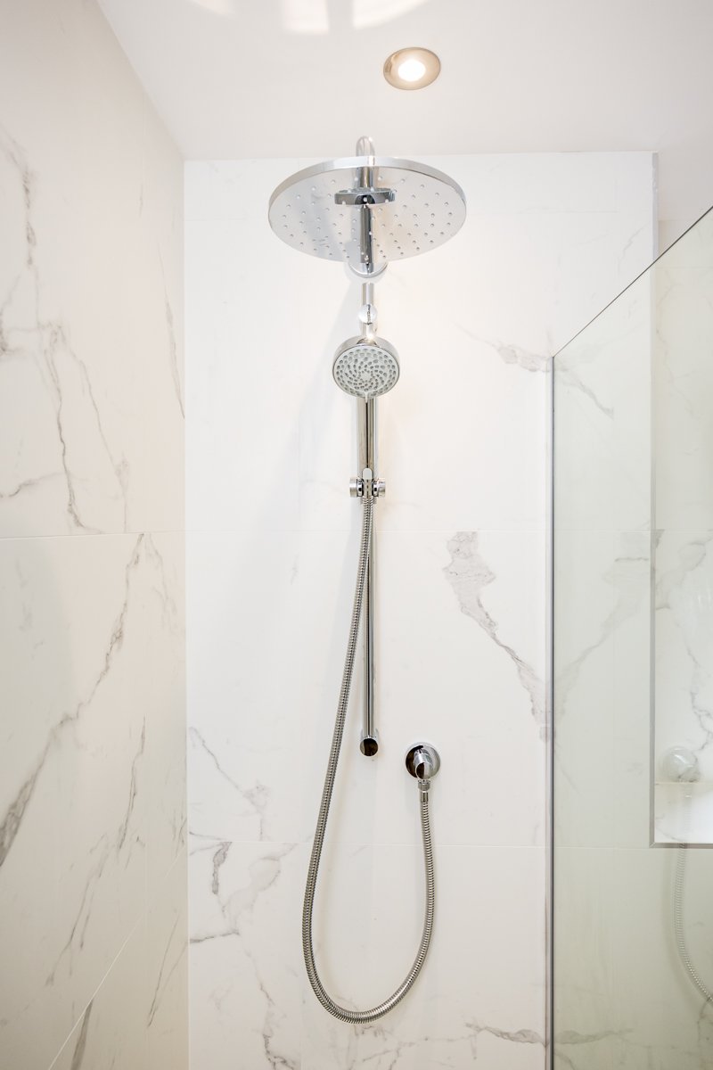 dual shower heads and marble effect shower panels