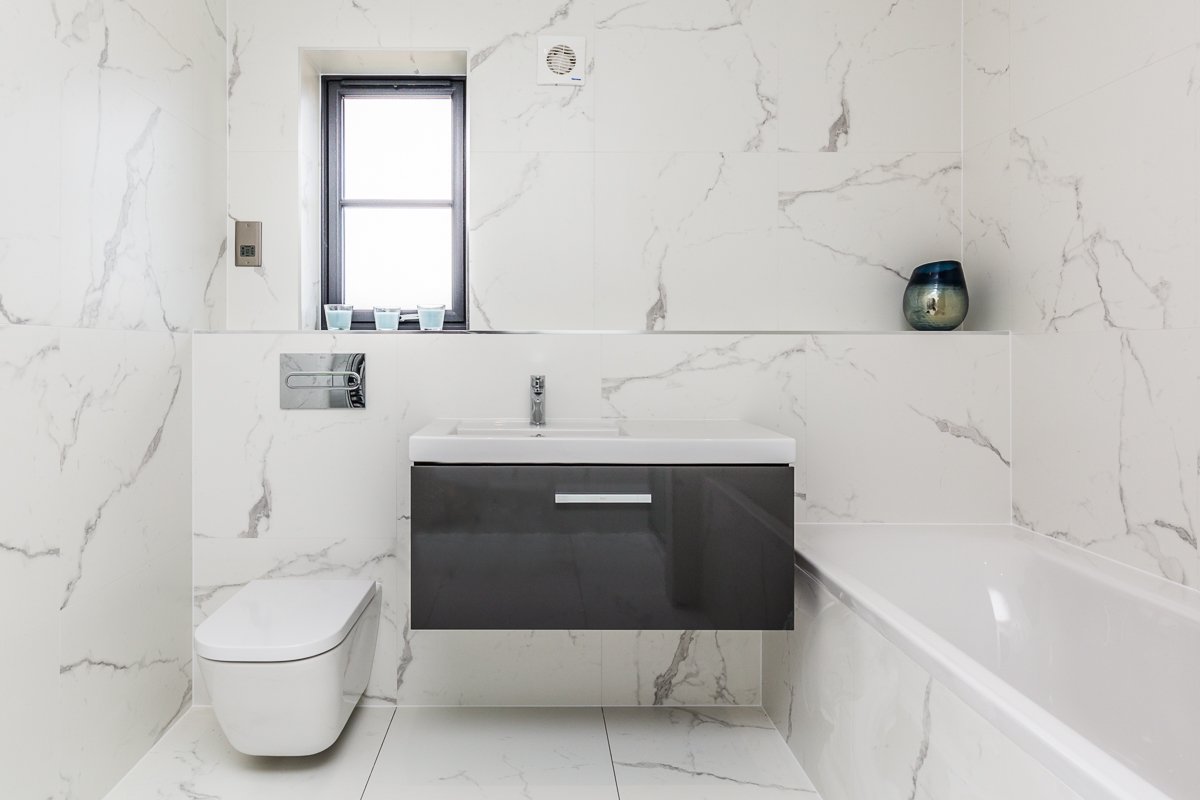 marble tiles in this floor to ceiling luxury bathroom