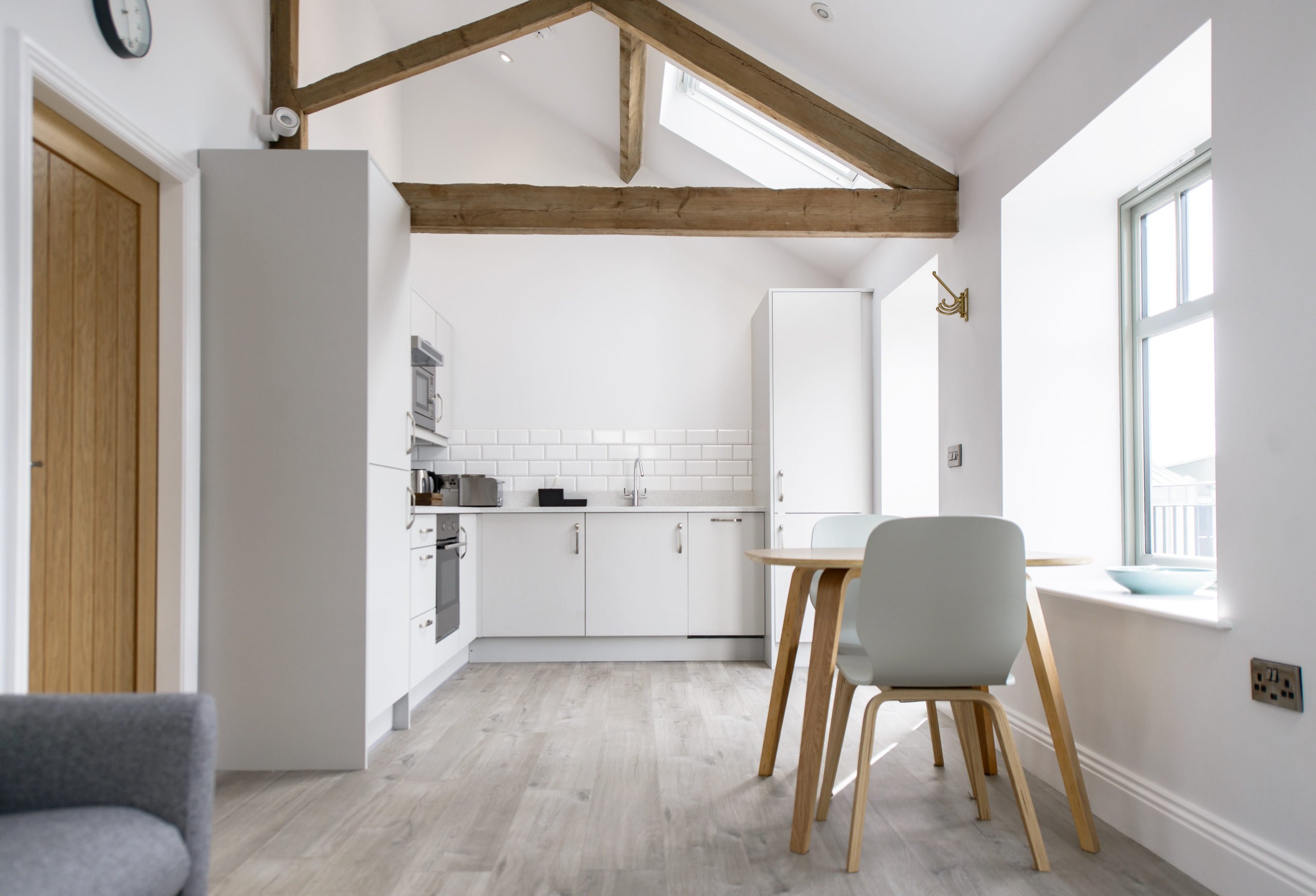 small kitchen ideas - make the most of a small space with white cabinets and lots of natural light