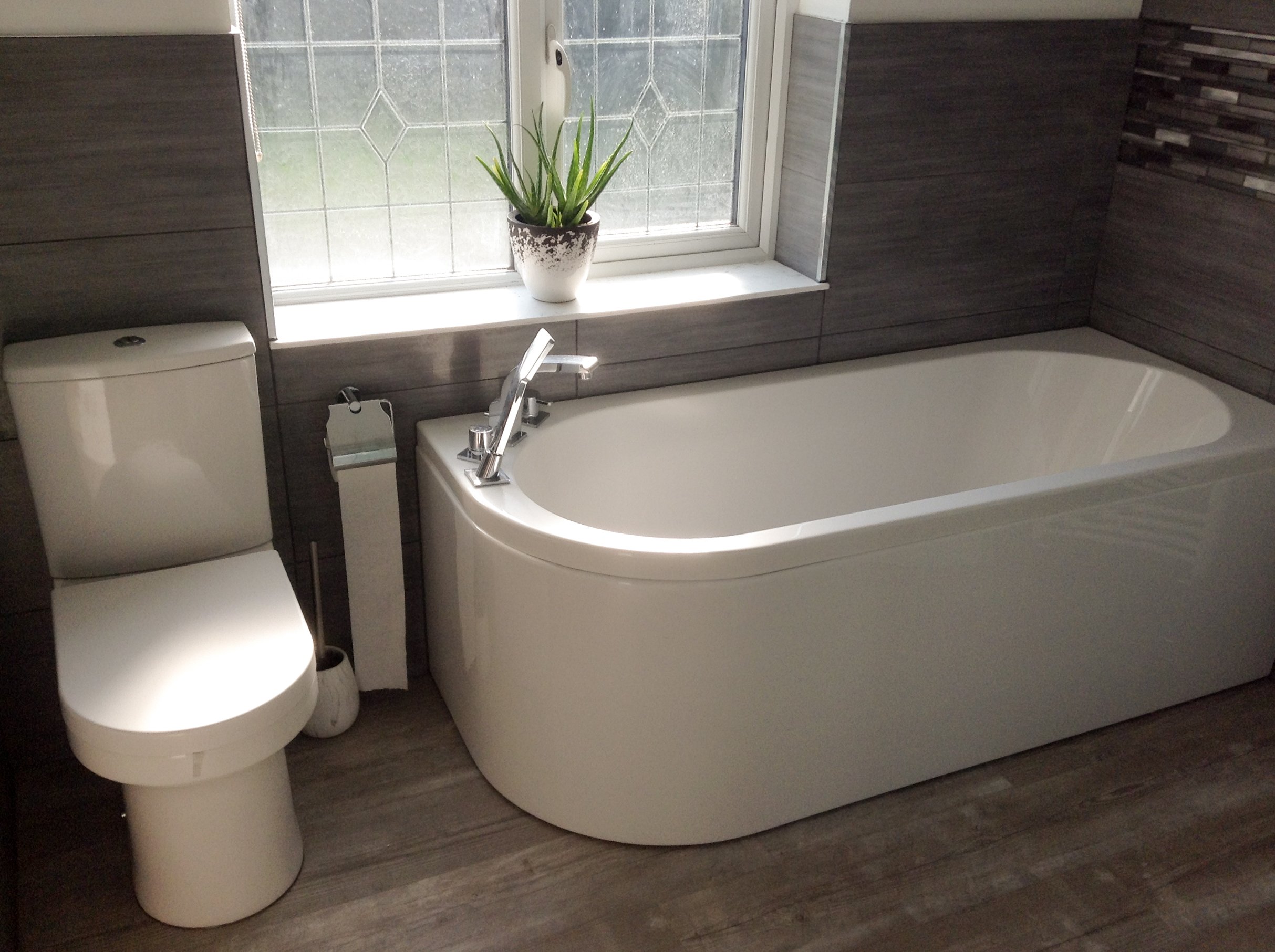 Modern bathroom suite - toilet and bathtub