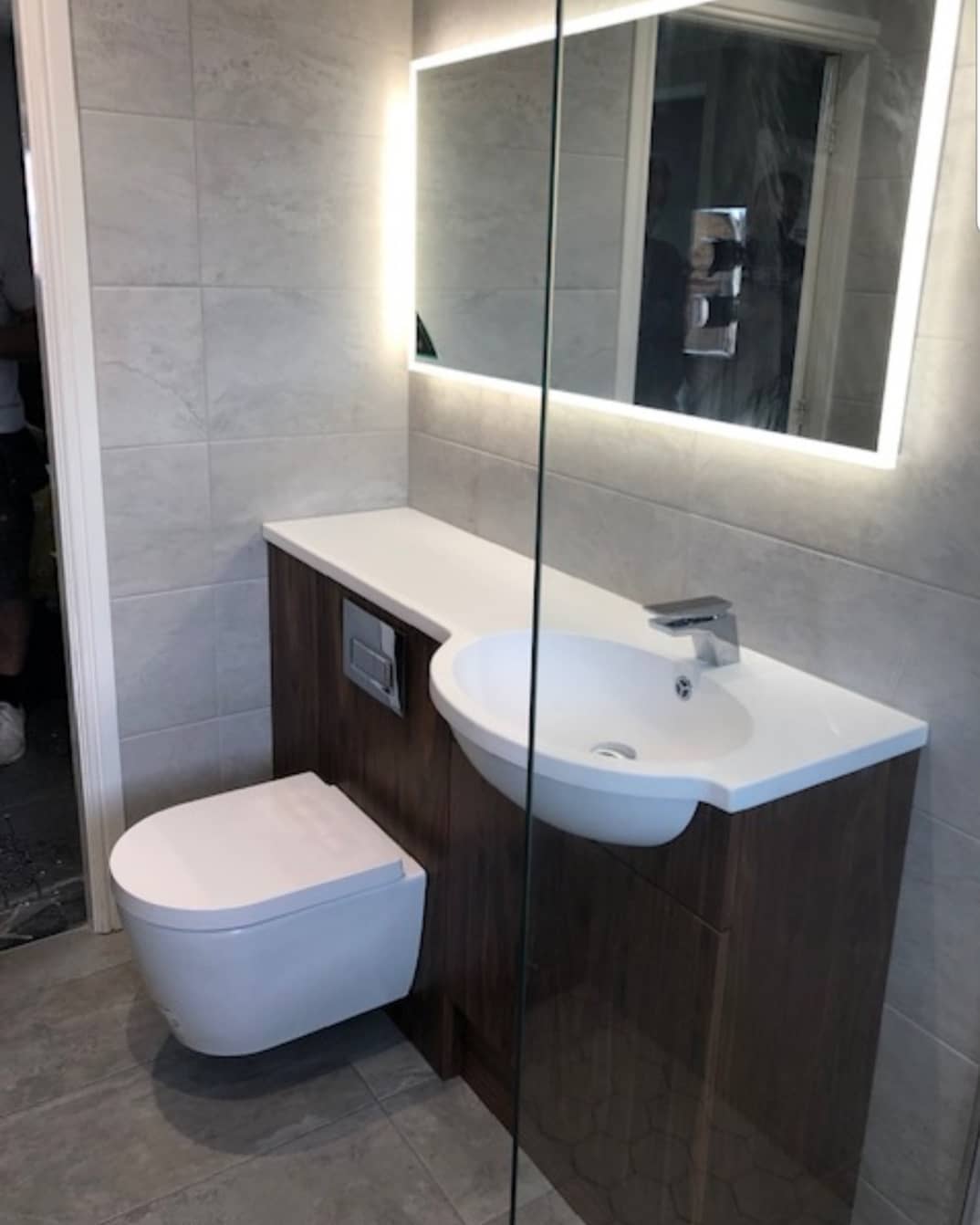 illuminated HIB mirror in this gorgeous grey bathroom