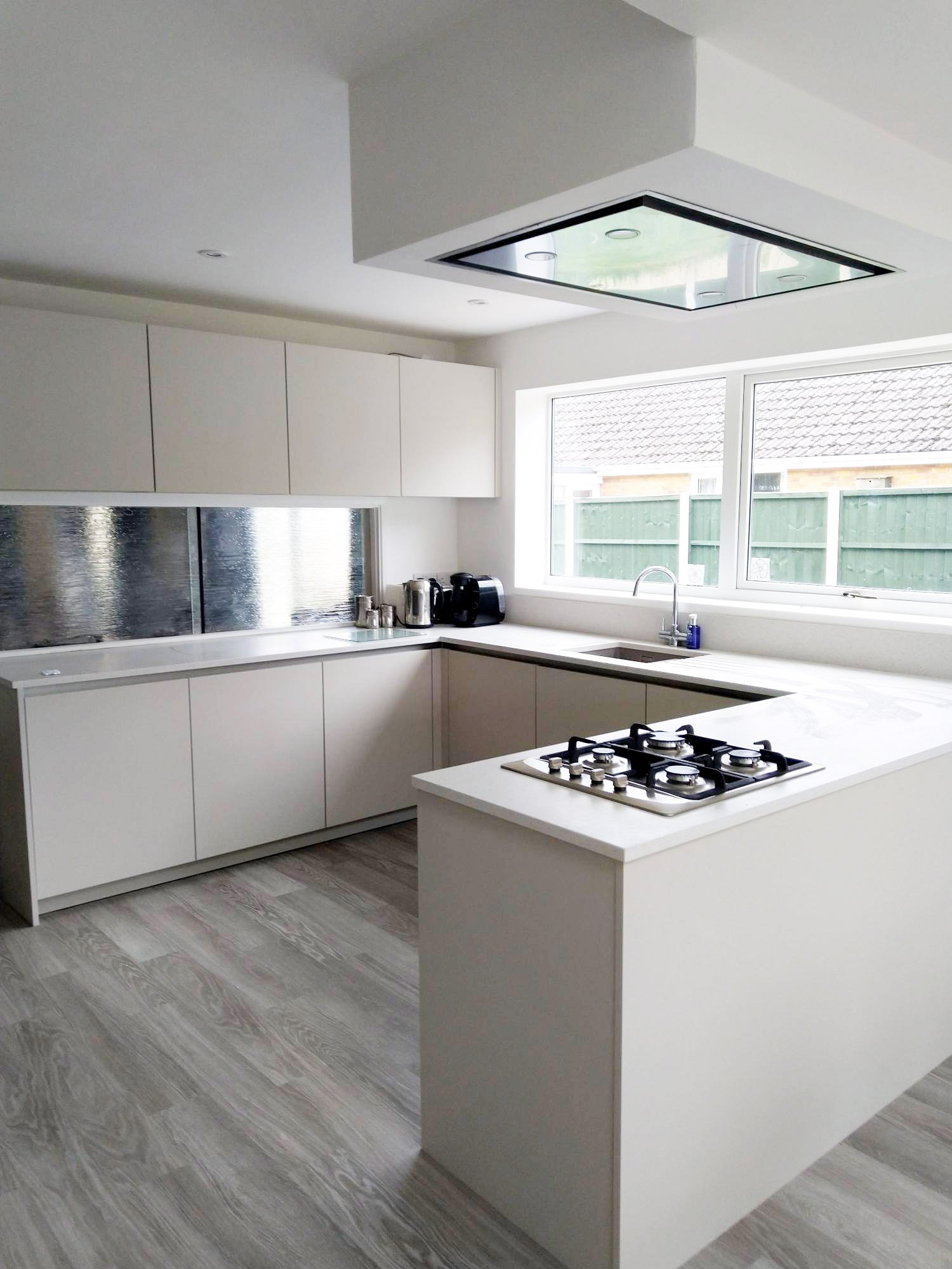 White kitchen with statement steel splashback