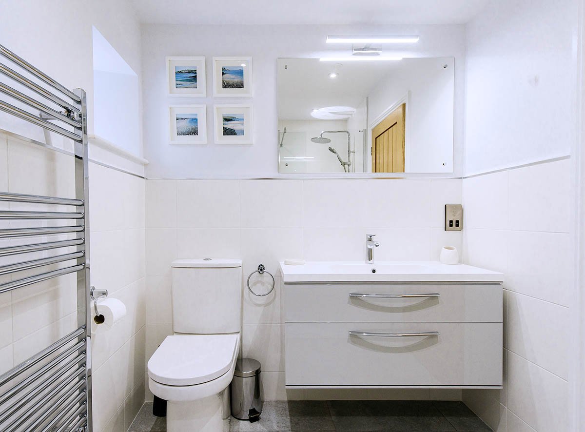 Bright white clean colours make this simple small bathroom shine