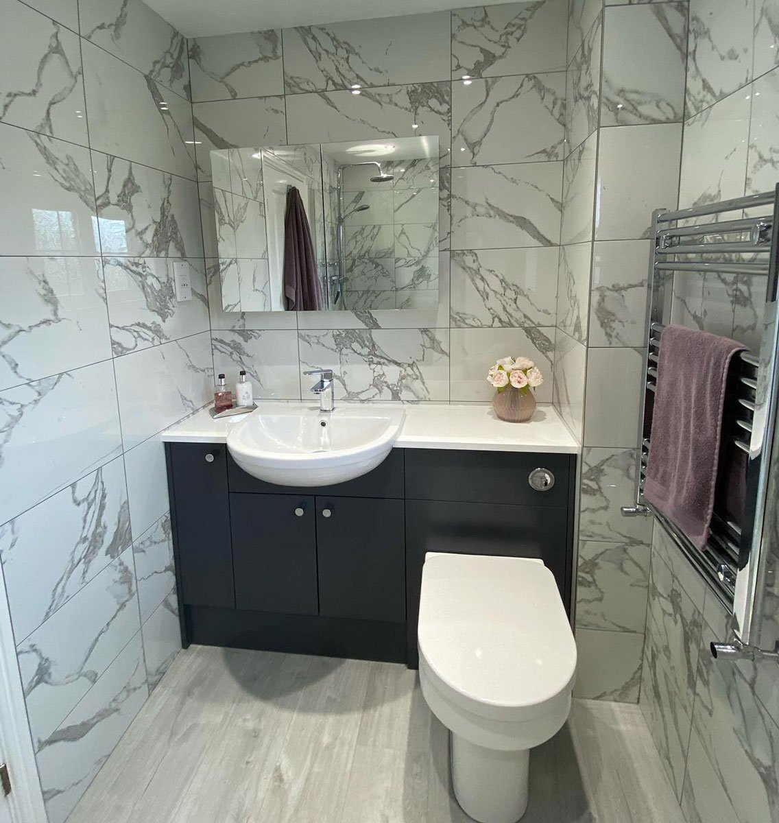 Marble effect tiles in modern bathroom
