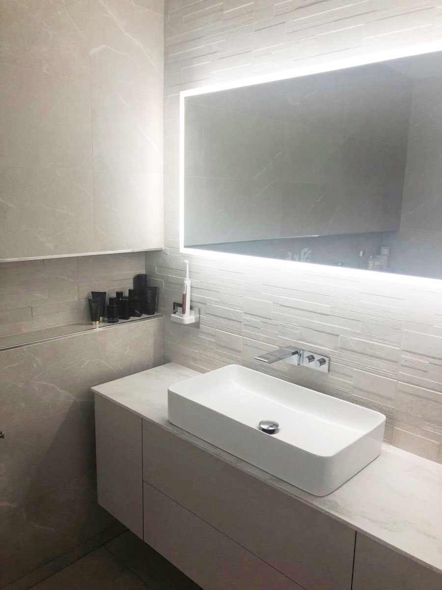 Modern Bathroom with large sink and illuminated lighting