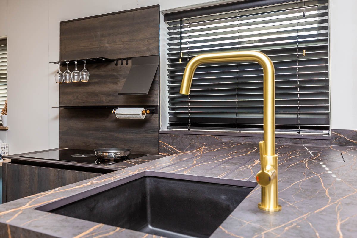 Gold marbled worktop with gold tap