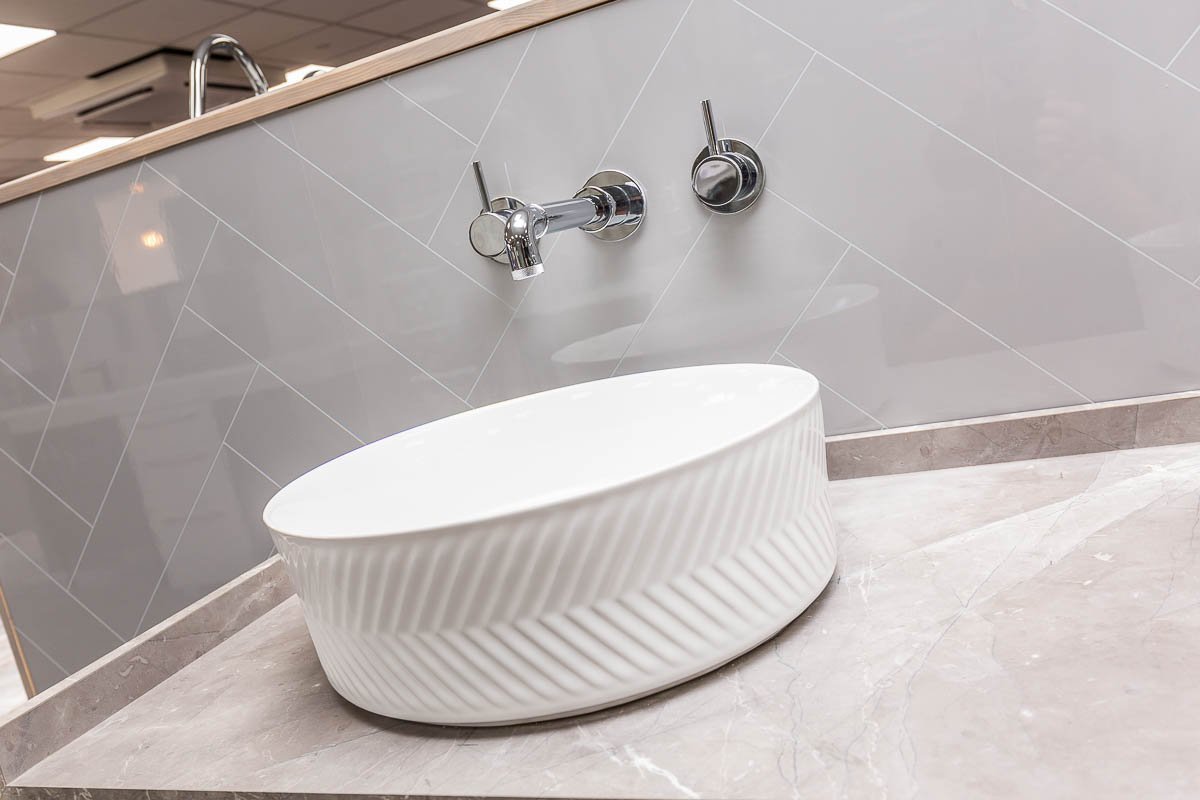 Modern countertop basin with wall-mounted tap