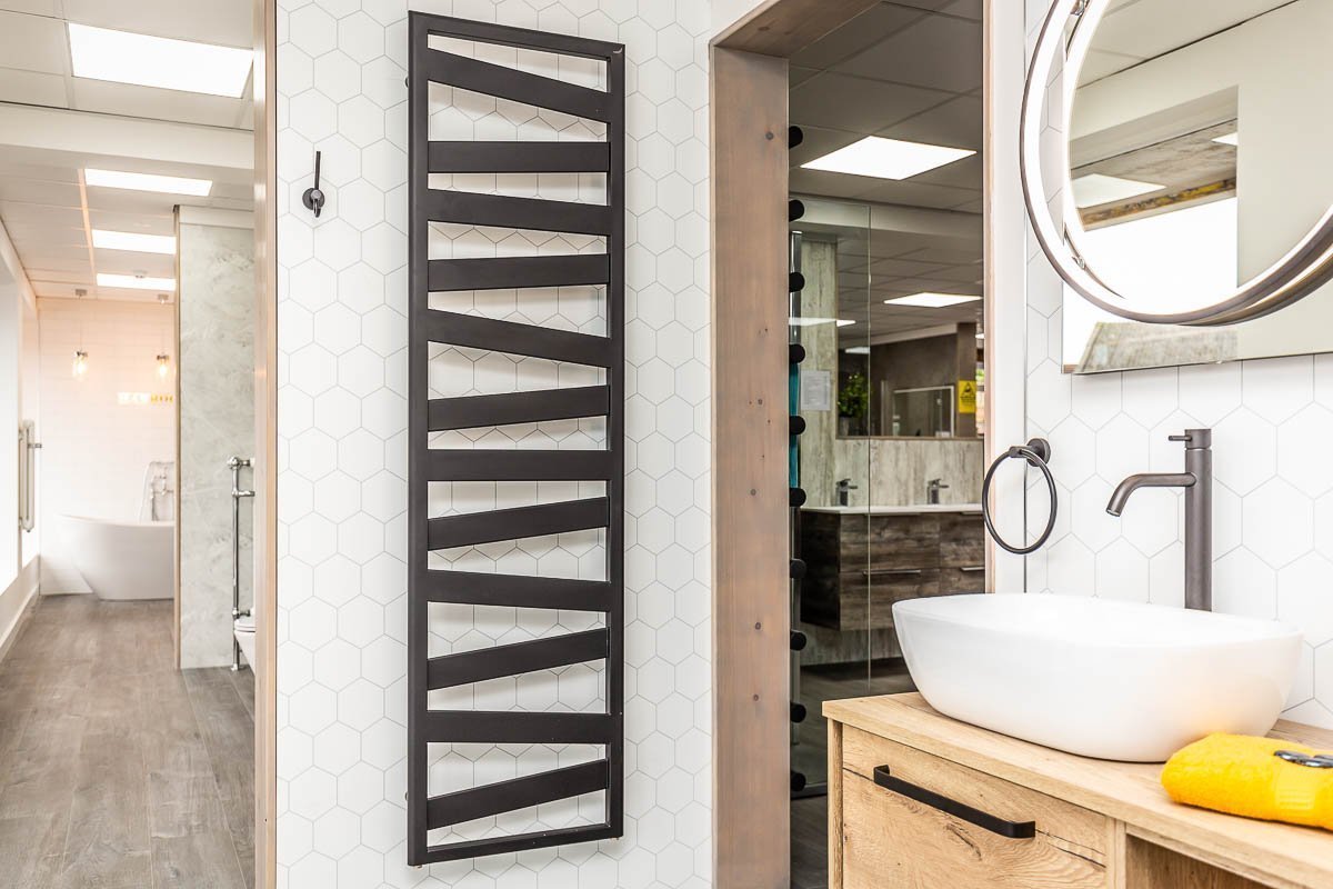 Modern towel warmer uses vertical space - great small bathroom idea