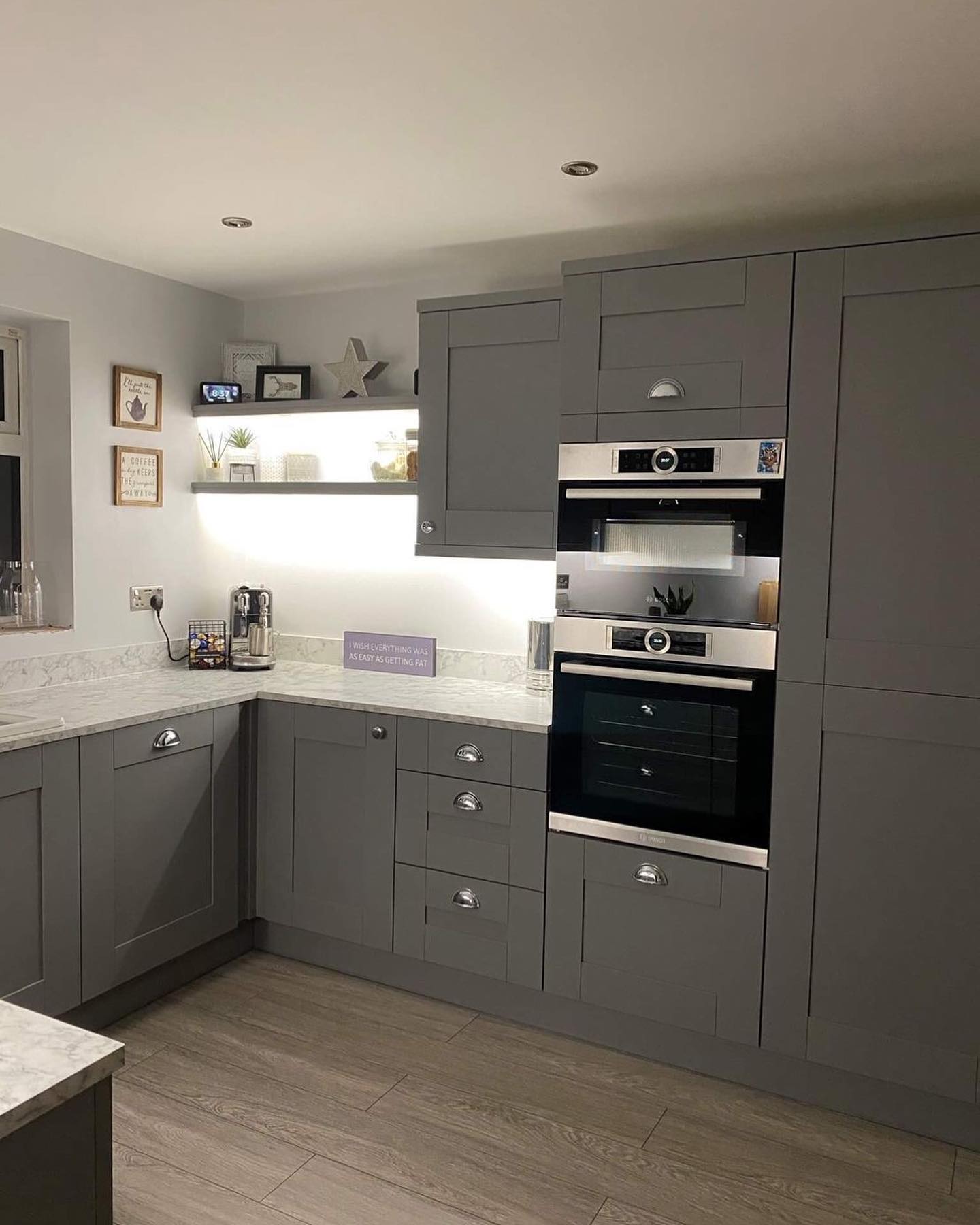 Grey Kitchen Cabinets with Double Neff Oven at comfort height
