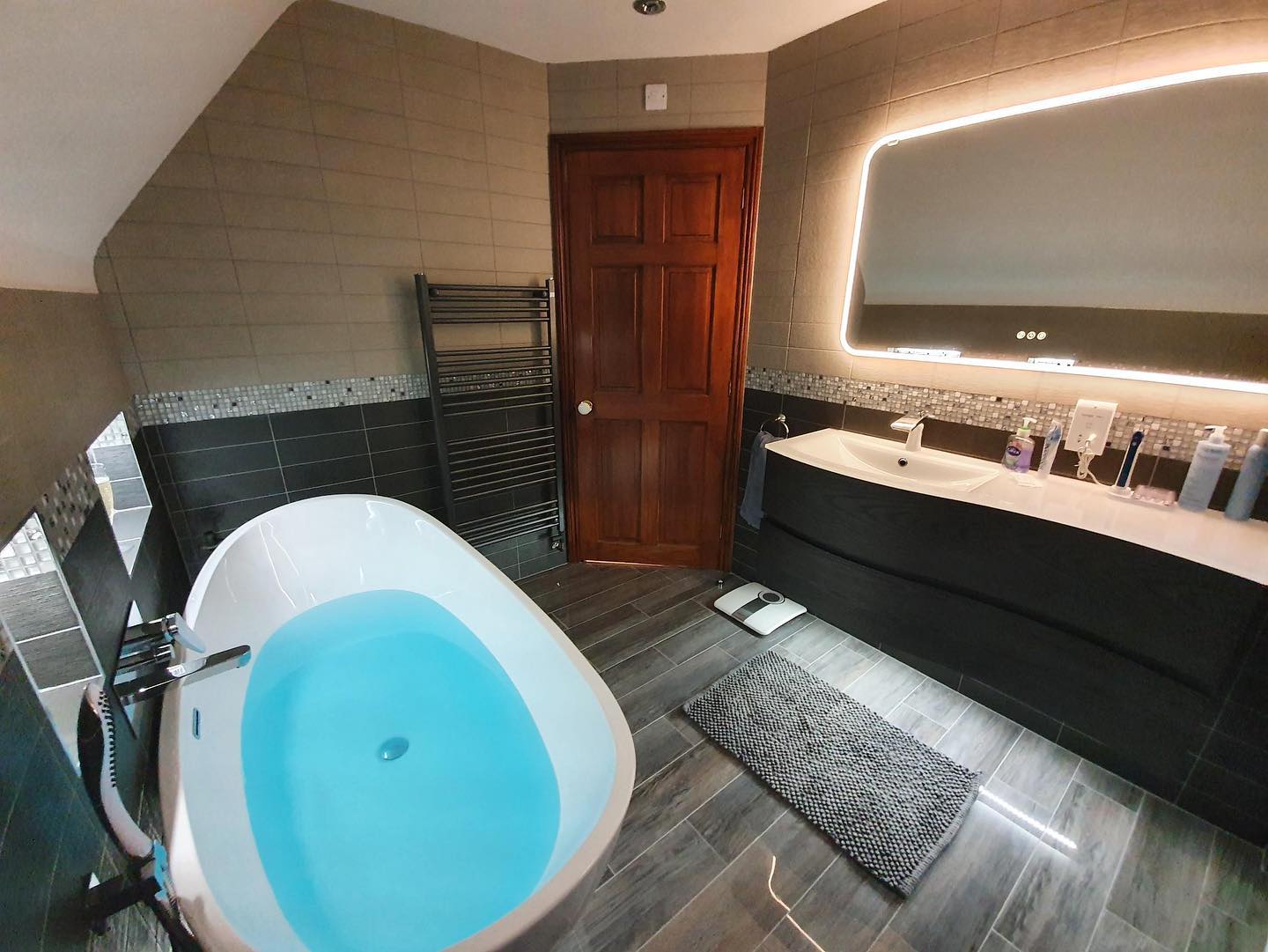 Luxurious modern bathroom with freestanding double ended bathtub