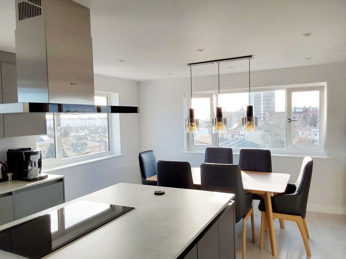 White worktop for grey fitted kitchen