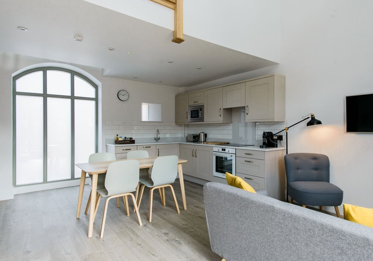 Modern,open plan kitchen, dining and living area in this holiday home barn conversion
