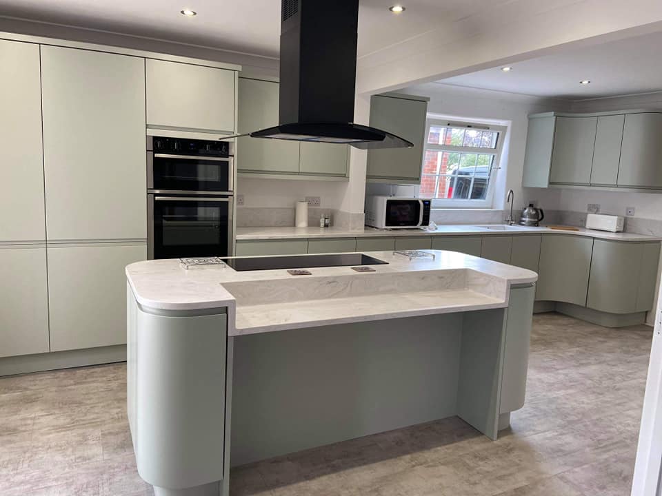 Pale Green Kitchen with Island with curved kitchen cabinets