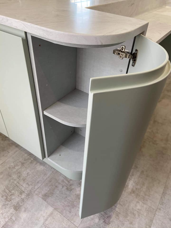 Pale Green kitchen cabinets from Symphony with storage solutions