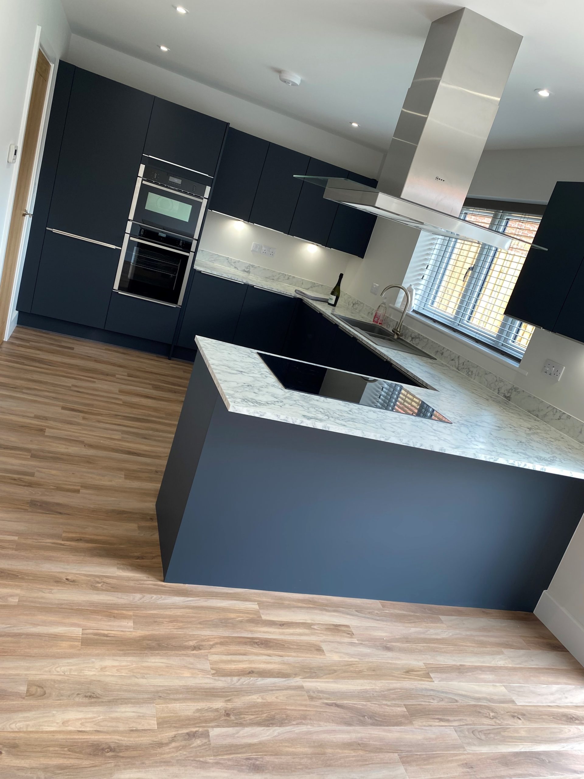 navigate to https://www.turnbull.co.uk/showrooms/case-studies/kitchens/symphony-navy-kitchen/