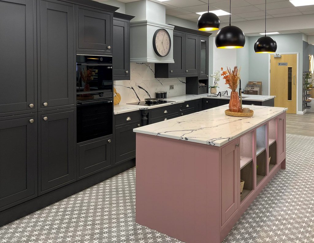 Black Shaker kitchen paired with pink and marble