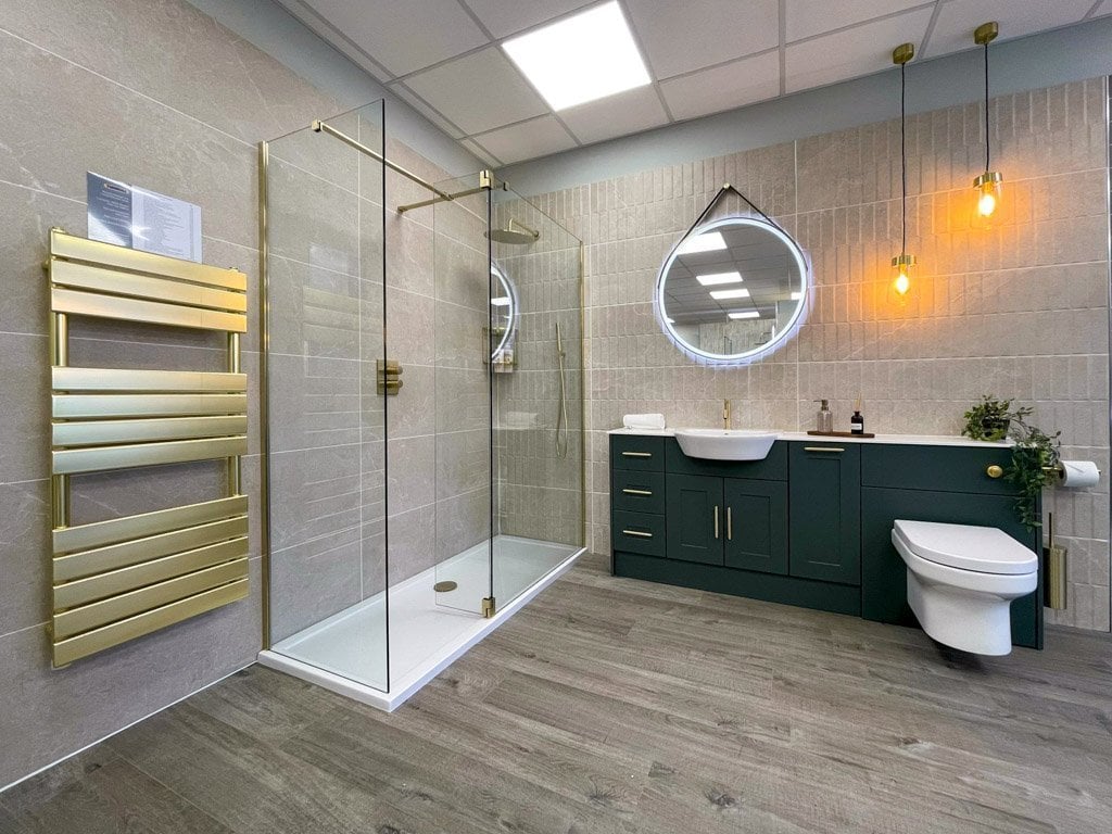 Bronze accents and lighting play a significant role in this bathroom.