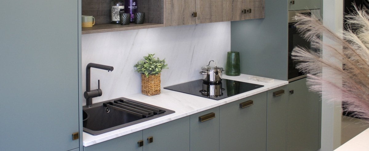 navigate to https://www.turnbull.co.uk/showrooms/case-studies/kitchens/compact-green-kitchen/