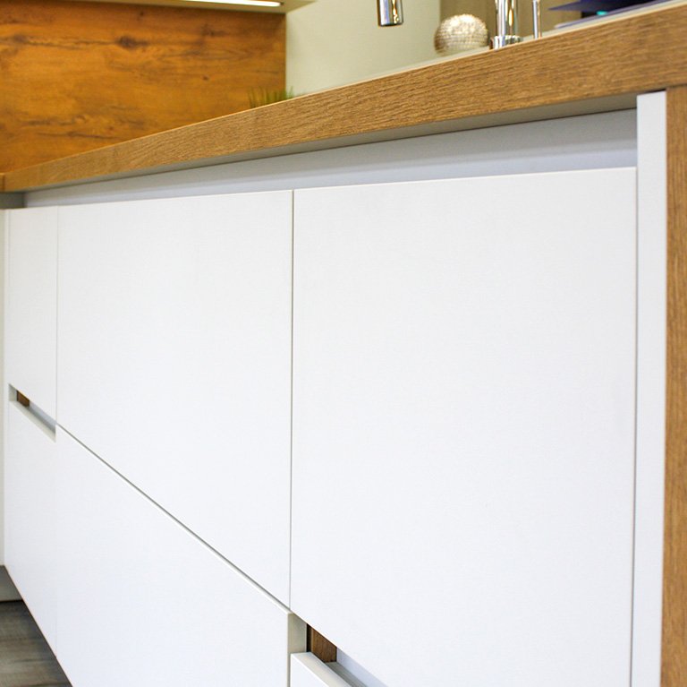Handleless white cabinets for a modern look