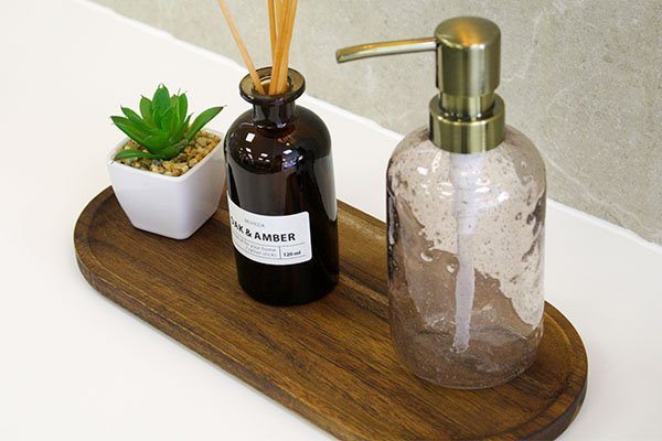 A choice of vanity unit accessories include brushed gold soap dispenser
